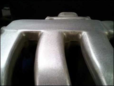 1994 Ford Probe - This is a close-up view of an intake manifold, likely from a car's engine bay.