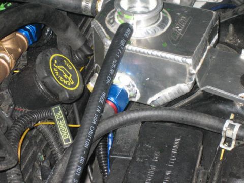 1996 Ford Thunderbird - Custom aluminum coolant reservoir and engine oil cap visible in the engine bay.
