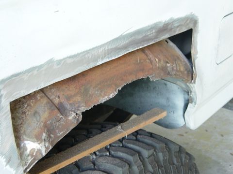 1993 Ford Bronco - Repairing rust damage in the wheel well area of a vehicle.