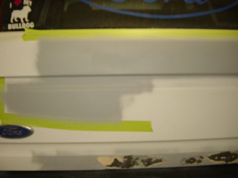 1993 Ford Bronco - Bodywork is underway on a Ford vehicle, indicated by the visible emblem and repair materials.