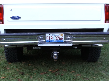 1993 Ford Bronco - Rear view of a 1993 Ford Bronco showing its chrome bumper, trailer hitch, and license plate.