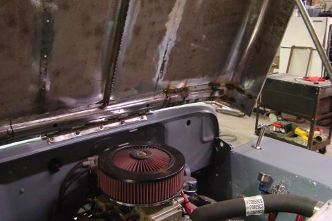 1948 Jeep Wrangler - Engine bay of a Jeep, hood open, with an aftermarket air filter installed.