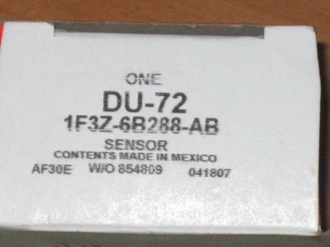1996 Ford Thunderbird - A close-up of a white cardboard box with black text labels. The box appears to contain a vehicle part, identified by text including "DU-72"…