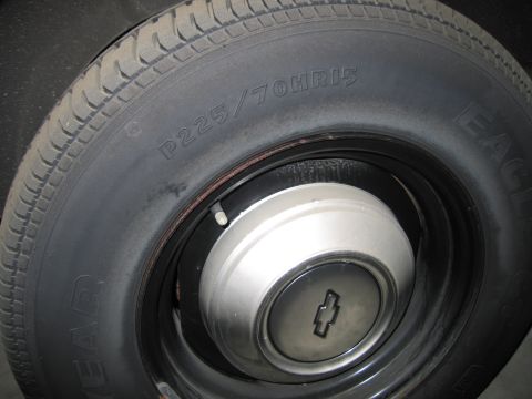 1991 Ford LTD Crown Victoria - Photograph of a Goodyear P225/70HR15 tire and Chevrolet hubcap, not a technical document.