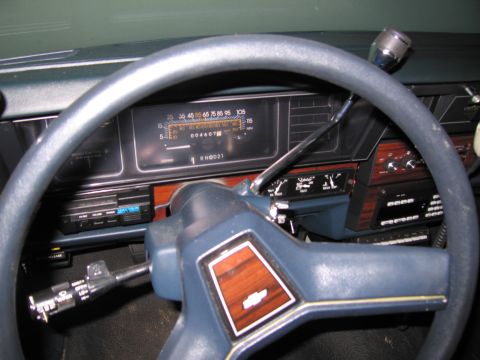 1991 Ford LTD Crown Victoria - Photograph of a vehicle dashboard, instrument cluster, and steering wheel, not a technical document.