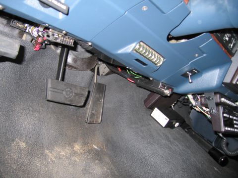 1991 Ford LTD Crown Victoria - Photograph of a vehicle footwell with brake and gas pedals, not a technical document.