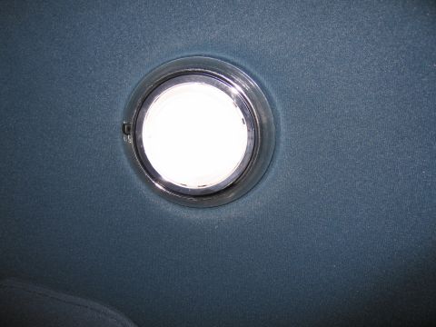 1991 Ford LTD Crown Victoria - Photo of a vehicle dome light on the headliner, not a document.