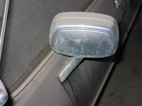 1991 Ford LTD Crown Victoria - Photo of a side mirror on a vehicle body, not a document.
