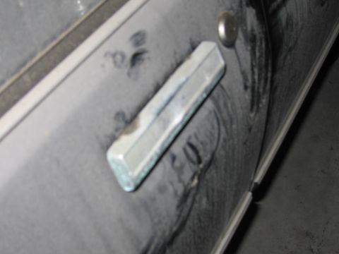 1991 Ford LTD Crown Victoria - Close-up photo of a vehicle door handle, not a document.