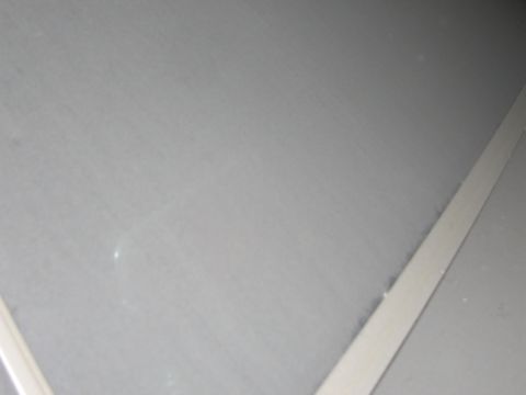 1991 Ford LTD Crown Victoria - Photo of a flat sheet-metal panel surface, not a document.