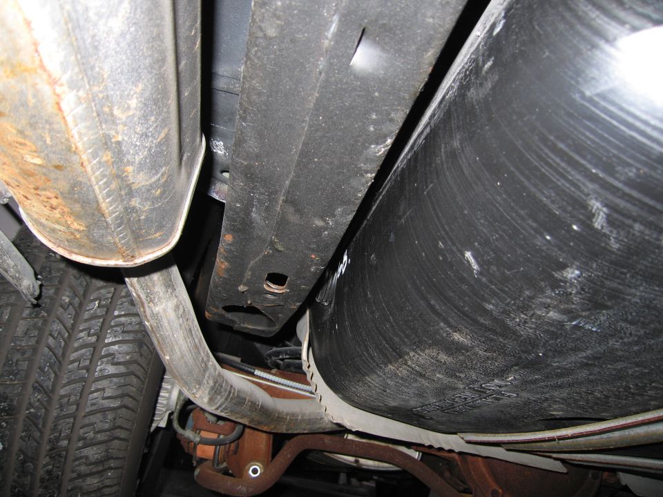 Undercarriage photo showing fuel tank, frame rail and exhaust
