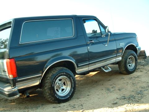 1991 Ford Bronco - Side view of a 1991 Ford Bronco with off-road tires.