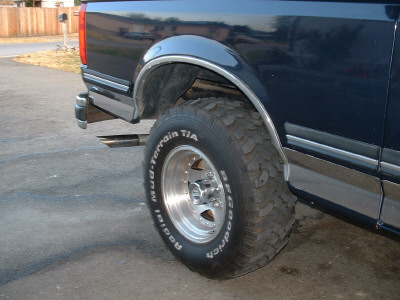 1991 Ford Bronco - Close-up of the rear wheel and fender flare on a 1991 Ford Bronco, BFGoodrich Mud-Terrain T/A tires.