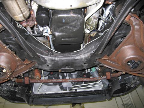 1991 Ford LTD Crown Victoria - The underside of a vehicle is shown, revealing its mechanical components and suspension system.
