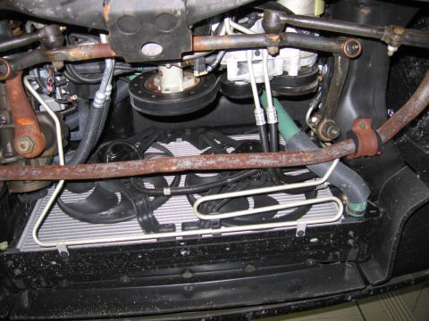 1991 Ford LTD Crown Victoria - Underside view of engine bay components including radiator, fans, and suspension parts.