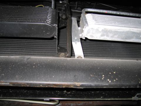 1991 Ford LTD Crown Victoria - Radiator and transmission cooler assembly, showing mounting hardware and fins.
