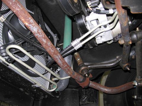 1991 Ford LTD Crown Victoria - Close-up view of the engine bay and suspension components of a 1991 Ford Crown Victoria LTD.