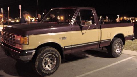 2007 Ford Mustang - Photograph of a Ford F-150 pickup in a parking lot, not a document.