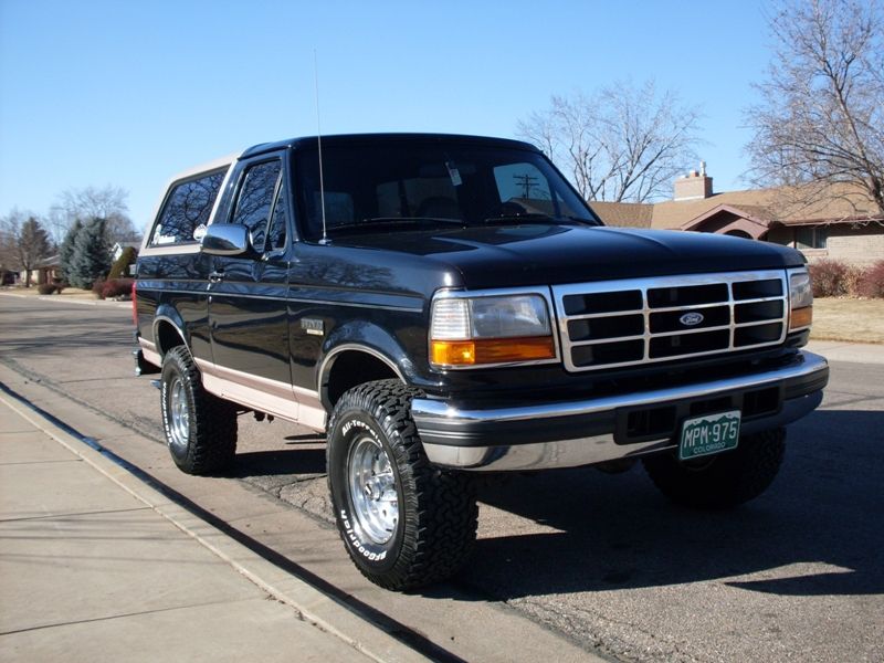 1996 Ford Bronco, lifted, black with tan top, chrome wheels, BFGoodrich All-Terrain tires, Colorado license plate MPM-975