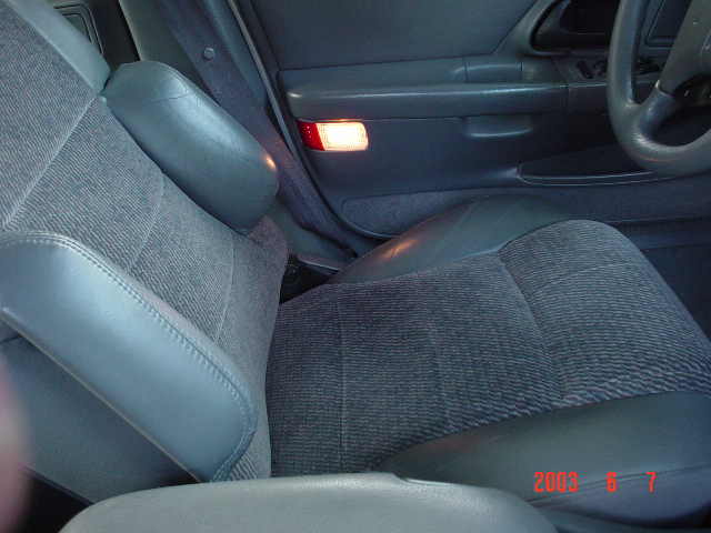 1/2 leather cloth interior with side bolsters, very comfy