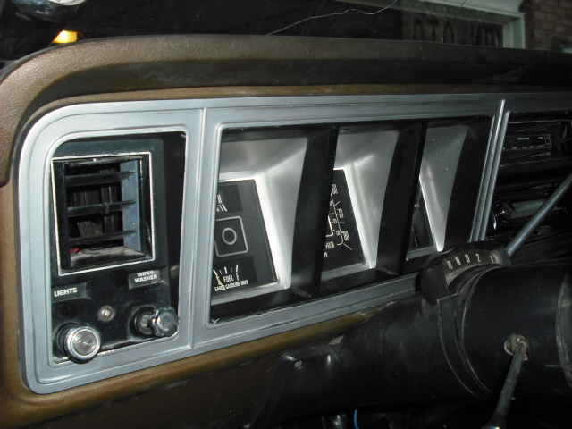 1979 Ford Bronco dashboard interior with instrument cluster, air vents, and steering column.