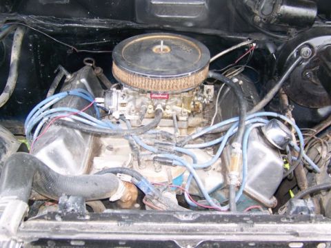 1983 Ford Ranger - Close-up of an engine bay, focusing on the carburetor and associated components.