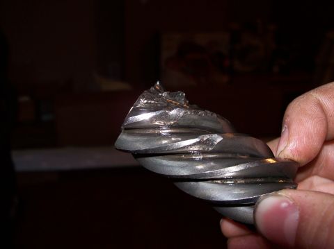 1992 Ford Bronco - A close-up view shows a damaged metal gear with visible breaks and chips.