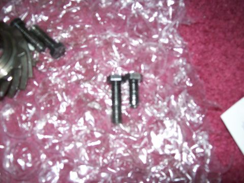 1992 Ford Bronco - Close-up of automotive parts, including bolts and gears, wrapped in bubble wrap.
