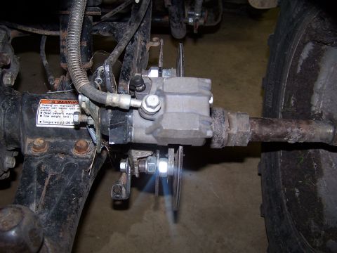 2007 Ford Bronco - Close-up of an engine part with various connections, likely from a vehicle.