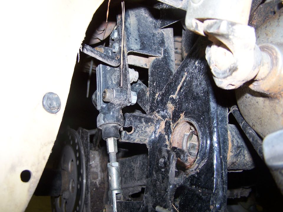 close-up of vehicle's rear suspension linkage and brake rotor