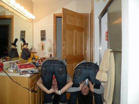 1900 Acura CL - Two people are bending over in a bathroom, with their jeans visible.