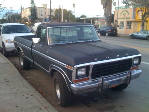 1979 Ford Bronco - This black Ford F-Series pickup truck appears to be from the late 1970s, likely a 1979 model based on its grille and body style.