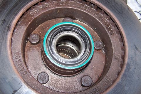 1990 Ford Bronco - This image shows a close-up view of a vehicle's wheel hub, brake rotor, and bearing assembly, with 'CANADA' stamped on the hub.