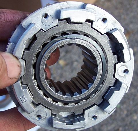 1990 Ford Bronco - Metal gear part with internal splines and external teeth, marked with 'J2'.