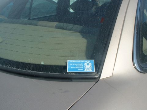 1999 Ford Crown Victoria - A sticker on the rear window indicates the vehicle is associated with the Washington State Patrol.