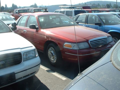 1999 Ford Crown Victoria - A Toreador Red '98 PI. Servered as an unmarked car that belonged to a LT.
