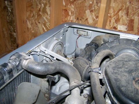 1988 Suzuki Samurai - Engine bay view of a 1988 Suzuki Samurai, hoses and air intake components.