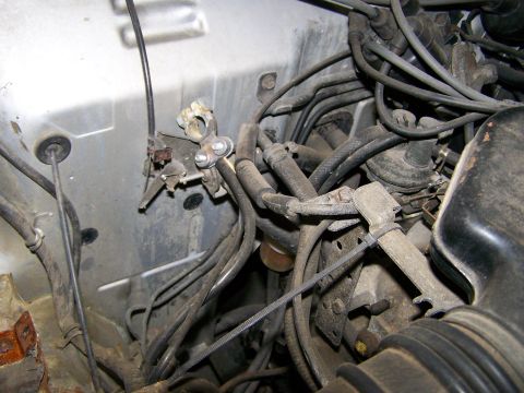 1988 Suzuki Samurai - Close-up view of the engine bay, showing various wires, hoses, and mechanical components.