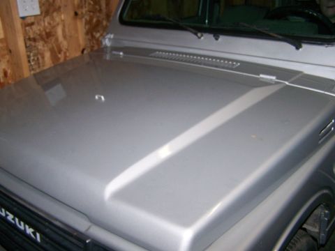 1988 Suzuki Samurai - Front view of a 1988 Suzuki Samurai showing the hood and grille detail.