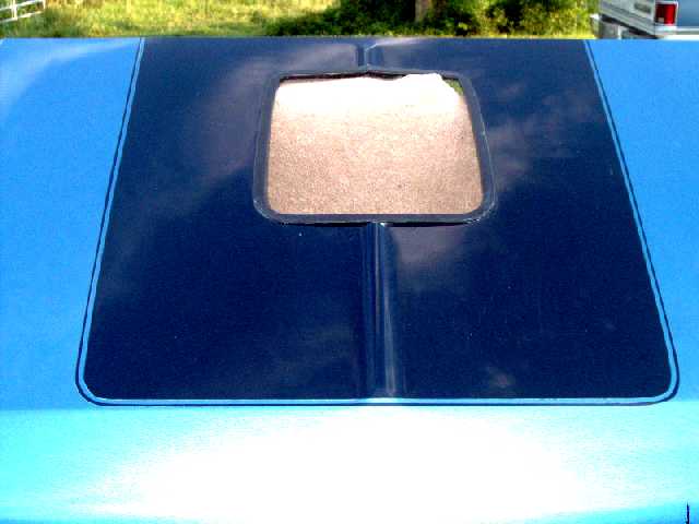 shaker hood, top view, Ford medium blue metallic, center is Ford indigo blue metallic, both are urethane-based. Trim ring is also glued around the opening.
