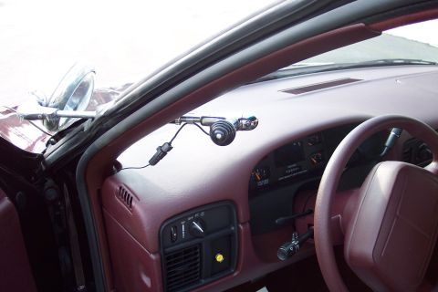2001 Ford Crown Victoria - Dashboard and interior of a 1996 Chevrolet Caprice, equipped with a spotlight.