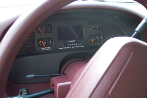 2001 Ford Crown Victoria - Interior view of a car's dashboard, showing fuel and temperature gauges.
