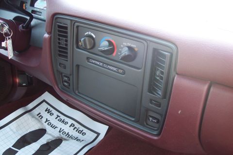 2001 Ford Crown Victoria - Interior view of a Caprice Classic dashboard, climate controls and a floor mat with a pride message.