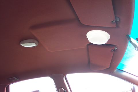 2001 Ford Crown Victoria - The headliner and sun visors of a car's interior are visible in this image.