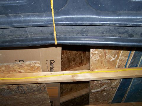 1988 Suzuki Samurai - Construction materials and wiring are visible inside a building's interior space.