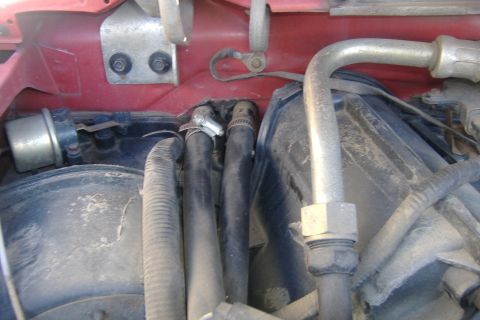 1989 Ford Bronco - Now go into the engine compartment and remove the two hoses.