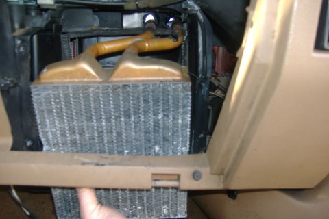 1989 Ford Bronco - System drained, hoses removed...take the old core out put the new one in. It's sort of a pain in the ass because it's a bit tight. You have…