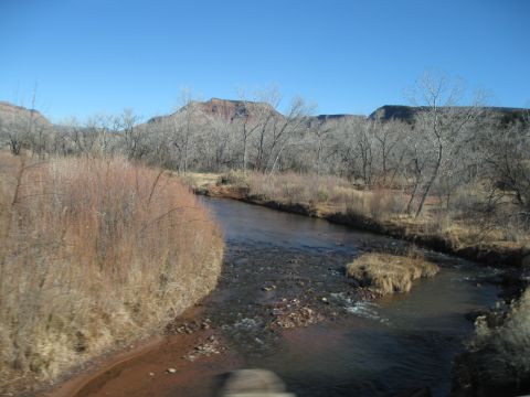 1993 Ford Bronco - A river winds through a winter landscape with hills in the background.