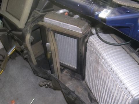 2007 Ford Mustang - Vehicle's HVAC evaporator core and condenser assembly shown removed from the interior.