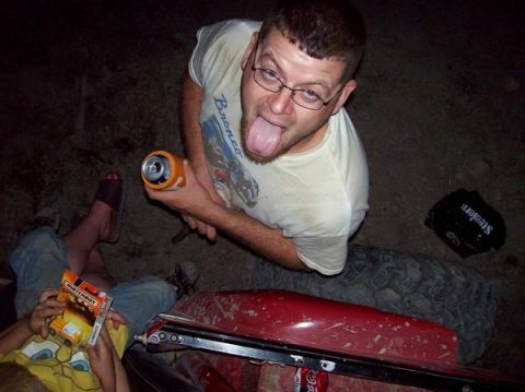 1978 Ford Bronco - Man with glasses and beard sticks his tongue out while holding a can. A child holds a Matchbox box.